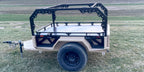 Tan Slack Wagon trailer with modular rack, side view