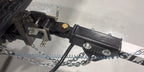 Articulating hitch on the Slack Wagon tongue with safety chains